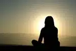 woman sitting on sand