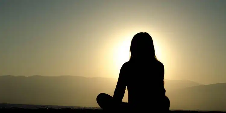 woman sitting on sand