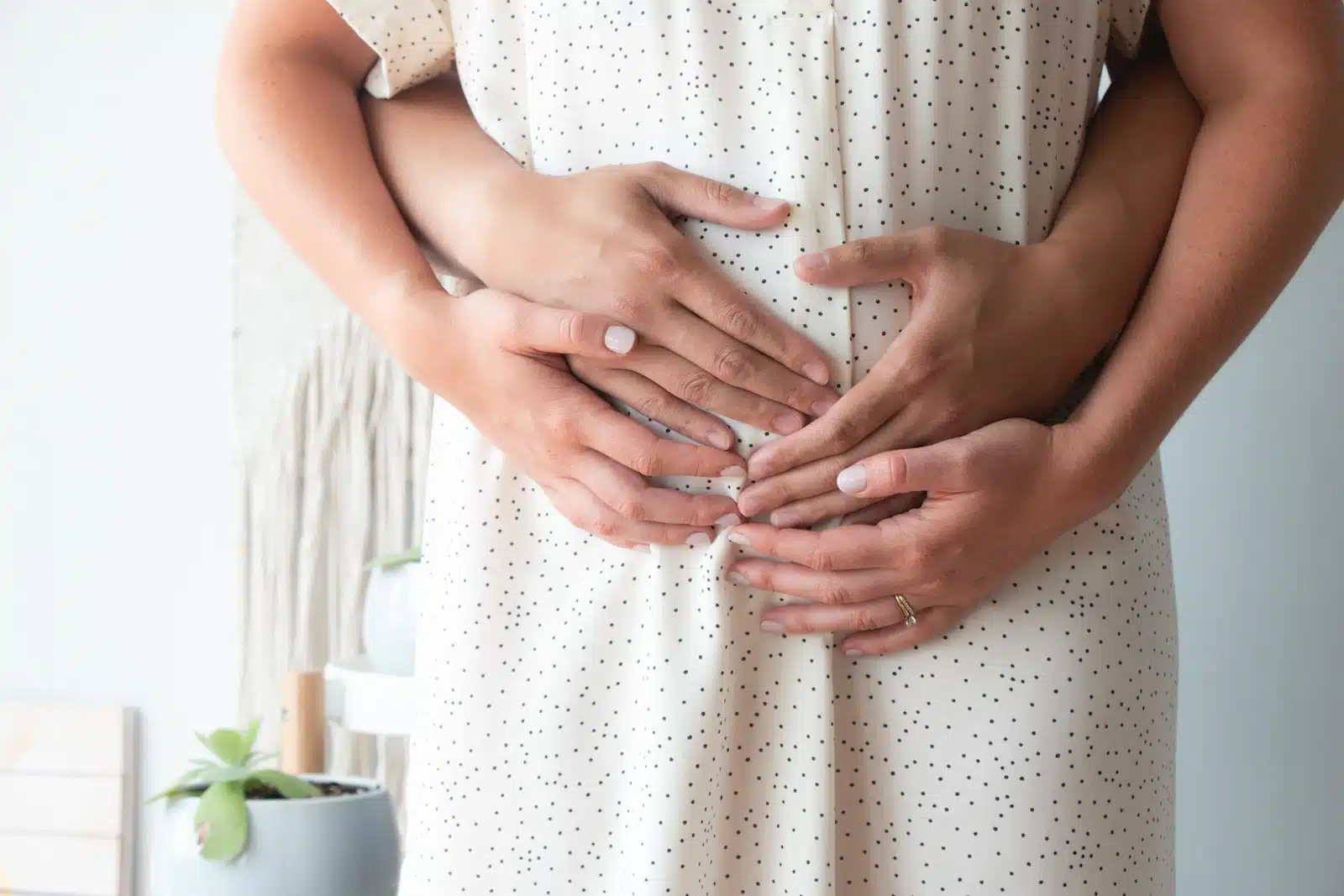 person touching person's belly